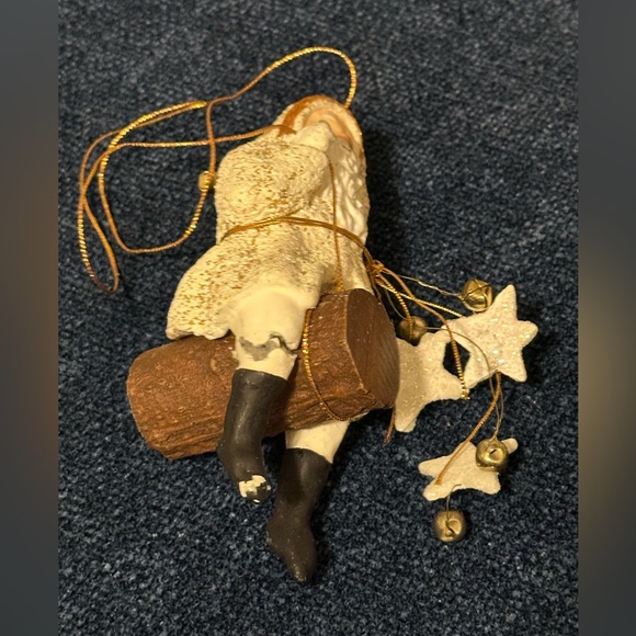 Wild western Santa hangs from gold thread with stars and bells. - Picture 5 of 8